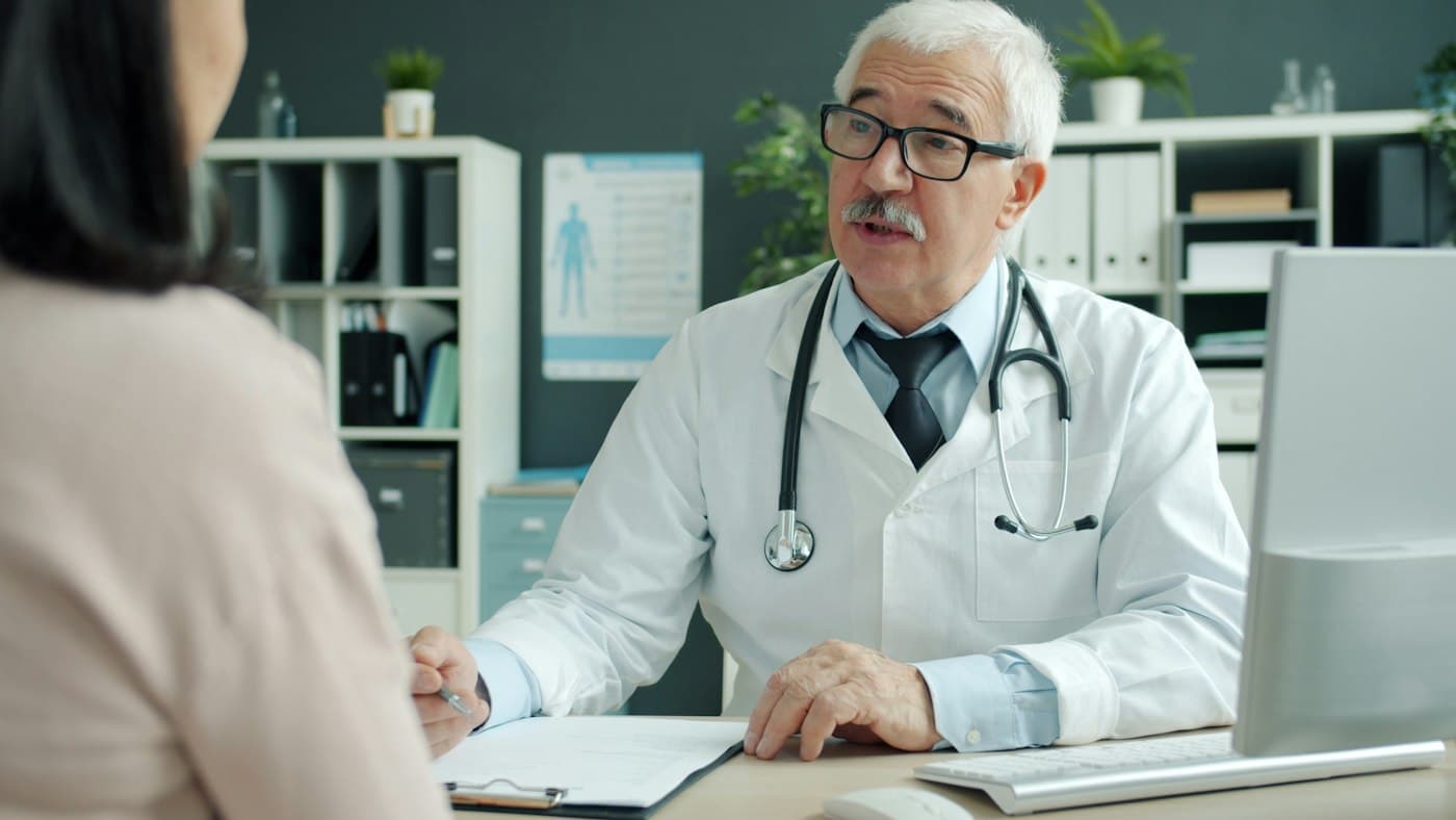 A physician talking with a patient in a clinic